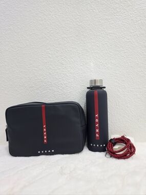 Prada Navy Toiletry Pouch and Matching glass water bottle with sleeve.